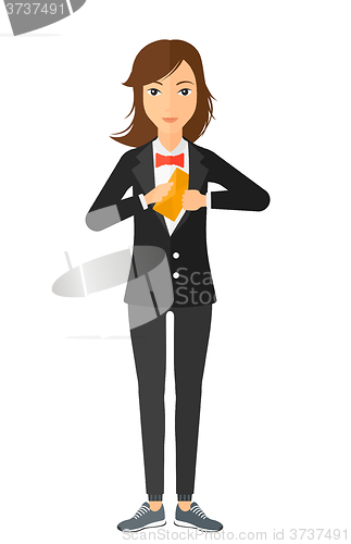 Image of Woman putting envelope in pocket.