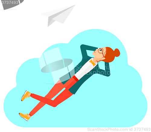 Image of Business woman relaxing on cloud.