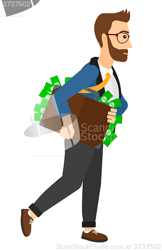 Image of Man with suitcase full of money.