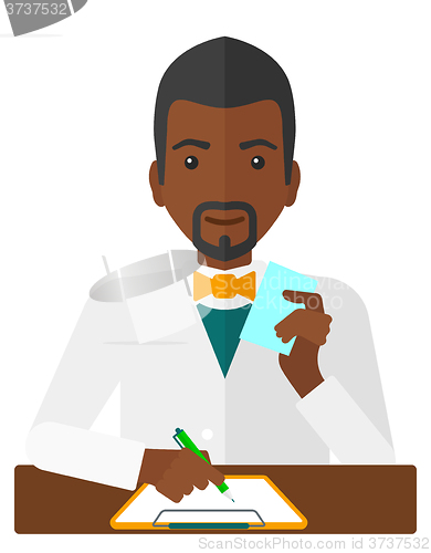 Image of Pharmacist taking notes.
