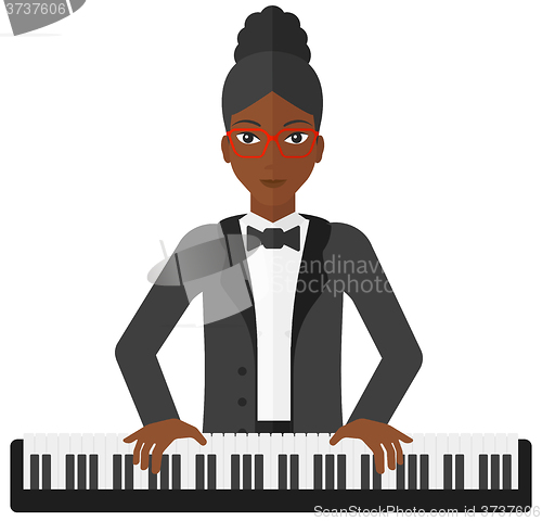 Image of Woman playing piano.