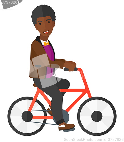 Image of Man riding bicycle.