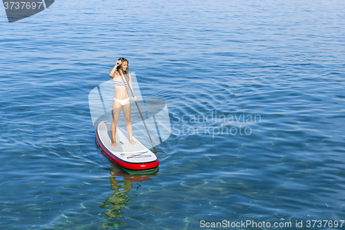 Image of Woman practicing paddle