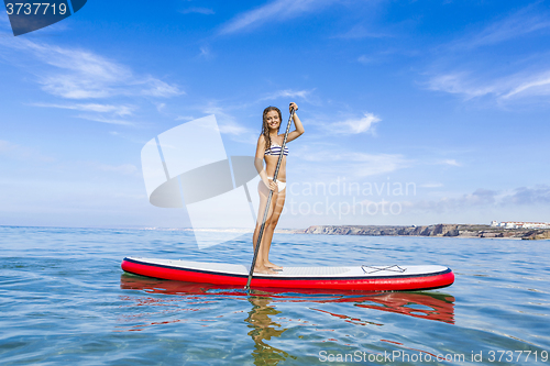 Image of Woman practicing paddle