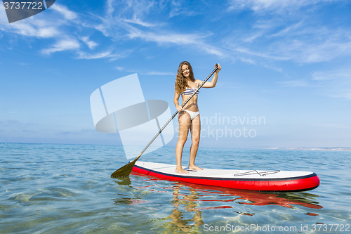 Image of Woman practicing paddle