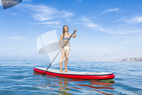 Image of Woman practicing paddle