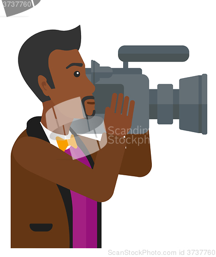 Image of Cameraman with video camera.