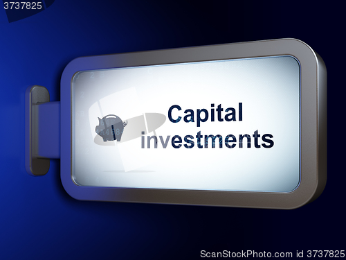 Image of Currency concept: Capital Investments and Money Box on billboard background