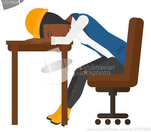 Image of Woman sleeping on table.