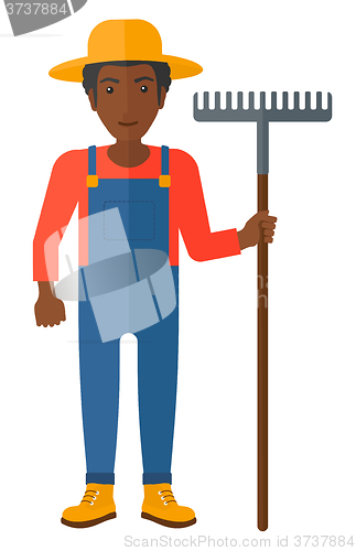 Image of Farmer with rake.