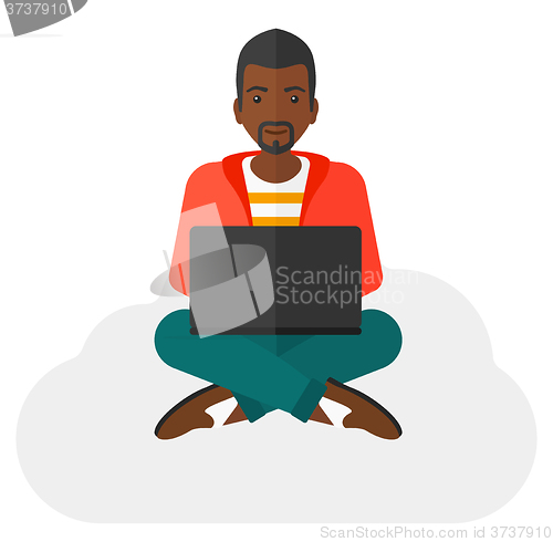 Image of Man sitting with laptop.