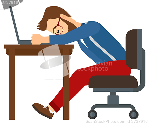 Image of Man sleeping on workplace.