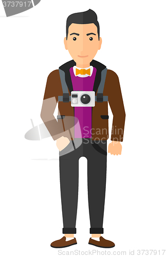 Image of Man with camera on chest.