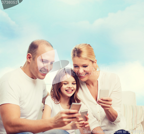 Image of happy family with smartphones