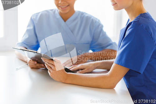 Image of close up of doctors with clipboard at hospital