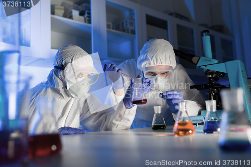 Image of close up of scientists making test in lab