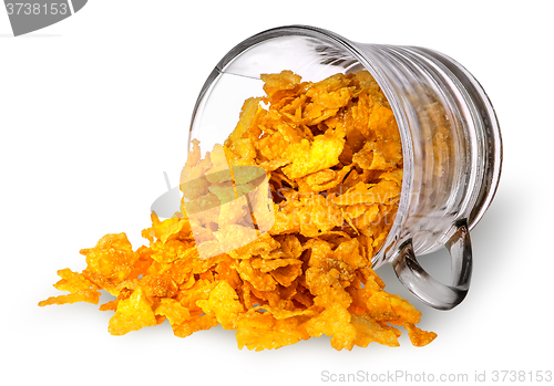 Image of Cornflakes spill out of a glass cup