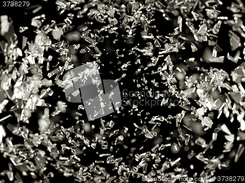 Image of Pieces of splitted or cracked glass on black shallow DOF