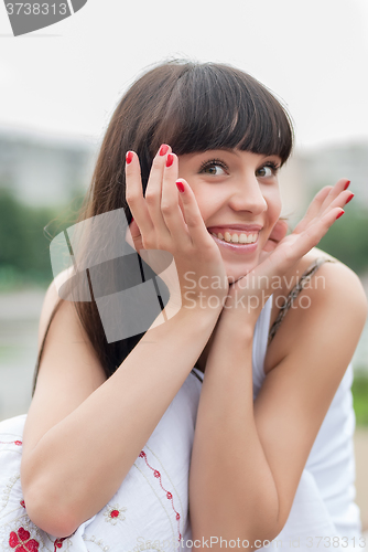 Image of Pretty woman smiling at the park