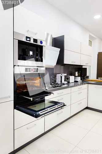 Image of Modern hi-tek kitchen, oven with door open