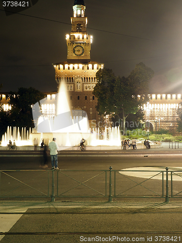 Image of editorial fountain night Sforza Castle Milan Italy