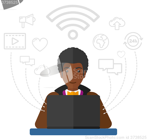 Image of Man working on laptop.