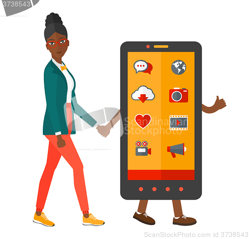 Image of Woman walking with smartphone.