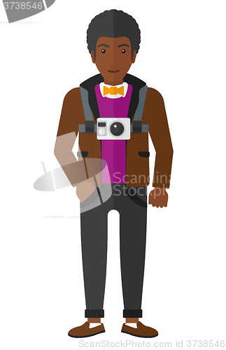 Image of Man with camera on chest.