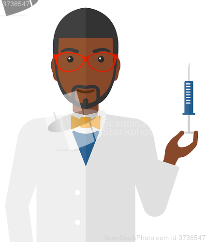 Image of Doctor holding syringe.