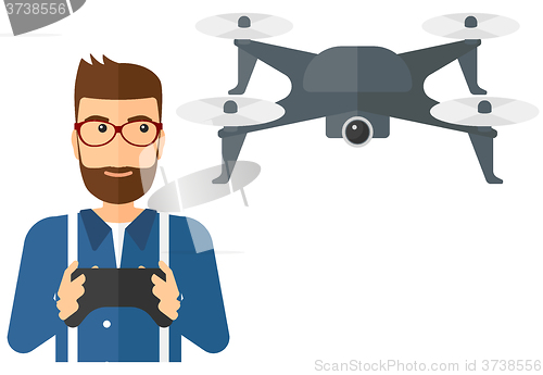 Image of Man flying drone.