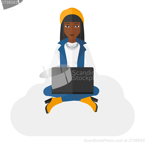 Image of Woman sitting with laptop.