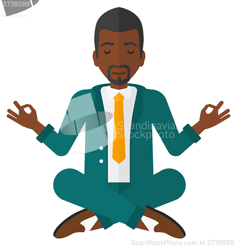 Image of Businessman meditating in lotus pose.