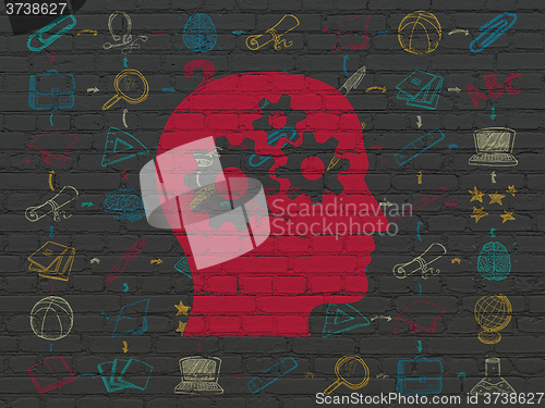 Image of Learning concept: Head With Gears on wall background