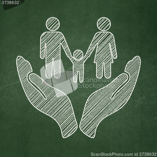 Image of Insurance concept: Family And Palm on chalkboard background