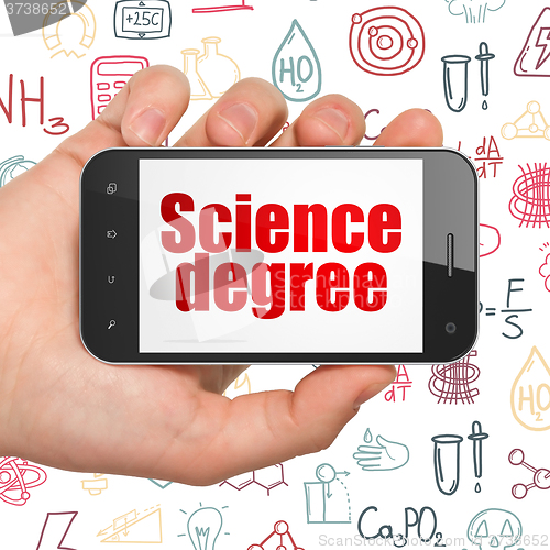 Image of Science concept: Hand Holding Smartphone with Science Degree on display