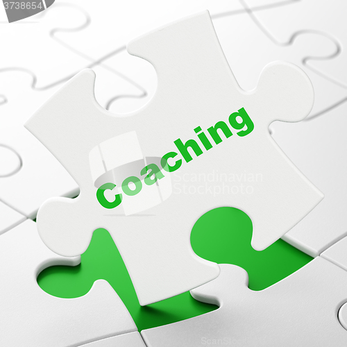 Image of Learning concept: Coaching on puzzle background