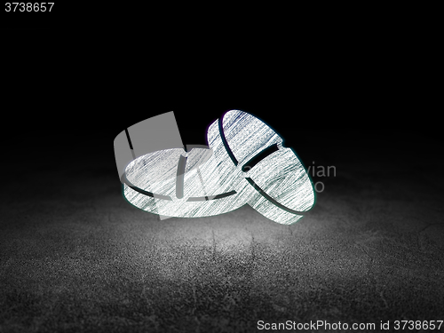 Image of Medicine concept: Pills in grunge dark room