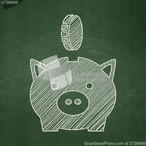 Image of Money concept: Money Box With Coin on chalkboard background