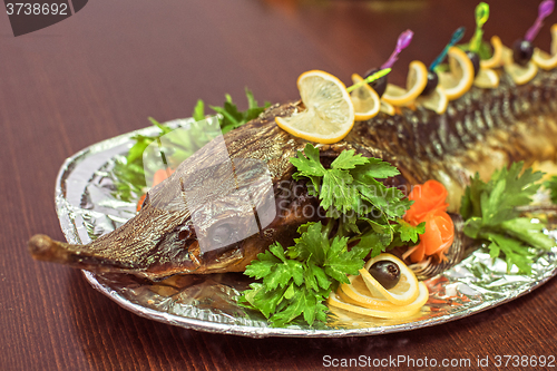 Image of sturgeon baked with greens