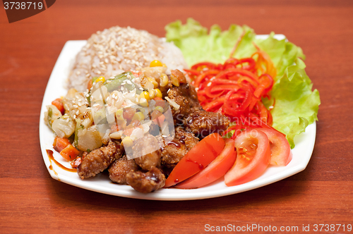 Image of rice with roasted meat and vegetables