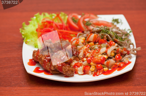 Image of chinese noodles with roasted meat and vegetables