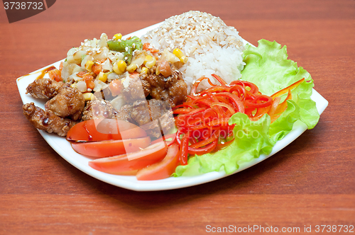 Image of rice with roasted meat and vegetables