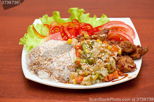 Image of rice with roasted meat and vegetables