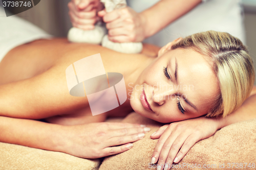 Image of close up of woman lying on massage table in spa