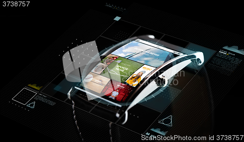 Image of close up of smart watch with media projection