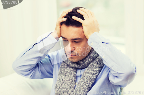 Image of close up of ill man with flu and headache at home