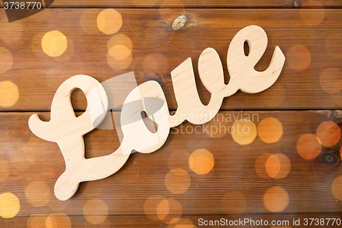 Image of close up of word love cutout on wood