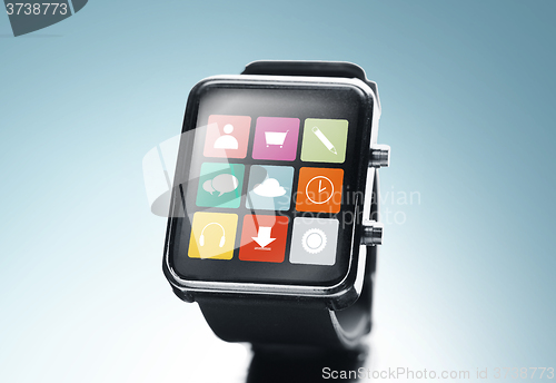 Image of close up of black smart watch with app icons