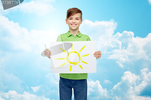 Image of happy boy holding drawing or picture of sun