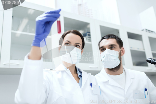 Image of young scientists making test or research in lab